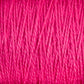 Close-up view of thick, pink, 5/2 Pearl Cotton Yarn from Supreme Corp densely wrapped together, showing textured strands and fibers intertwined.