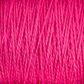 Close-up image of the vibrant pink, 5/2 Pearl Cotton Yarn | Mini-cone by Supreme Corp, showing tightly woven fibers and a rich texture. The yarn appears to be soft and slightly glossy, perfect for weaving projects where uniformity and sheen are key.