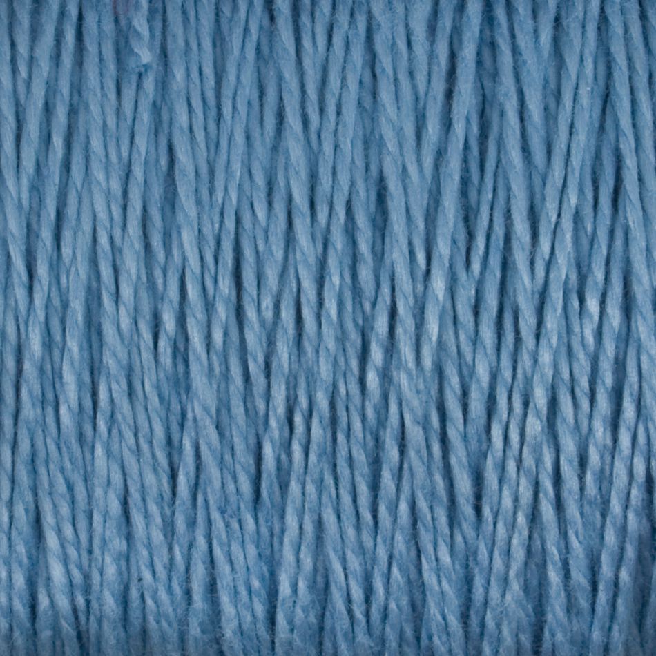 Close-up image of blue 5/2 Pearl Cotton Yarn by Supreme Corp. The yarn boasts a smooth texture, consistent thickness, and a slight sheen. Arranged vertically, the strands reveal detailed fibers and a uniform color. This versatile yarn on a large cone is ideal for various projects due to its durability and elegance.