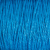 Close-up image of bright blue, 5/2 Pearl Cotton Yarn from Supreme Corp tightly wound together on a large cone, showcasing the texture and details of the twisted mercerized fibers. The image captures the vibrant color and intricate pattern of this versatile yarn.