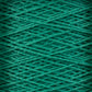 Close-up image of Supreme Corp's 5/2 Pearl Cotton Yarn wound tightly in overlapping layers, creating a textured pattern. The green yarn has a soft and slightly fuzzy appearance, giving the image a cozy and crafty feel—perfect for weaving projects.