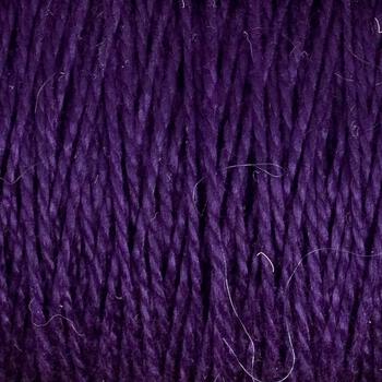 Close-up of Supreme Corp's 5/2 Pearl Cotton Yarn in purple, showcasing tightly woven strands and varying shades that create a textured appearance. Some loose fibers are visible, adding intricate detail to the yarn on the large cone.