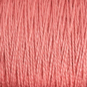 Close-up view of a bundle of Supreme Corp's 5/2 Pearl Cotton Yarn | Large Cone in pink, showcasing its soft and slightly twisted texture. The yarn appears thick and smooth, suitable for knitting or crochet projects. The image highlights the even consistency and subtle sheen of this versatile yarn's fibers.