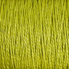 Close-up of Supreme Corp's 5/2 Pearl Cotton Yarn in green, showing tightly packed fibers with a slight sheen. The texture appears soft and smooth, with each strand clearly visible. The background is out of focus, emphasizing the intricacy of this versatile yarn's strands on the large cone.