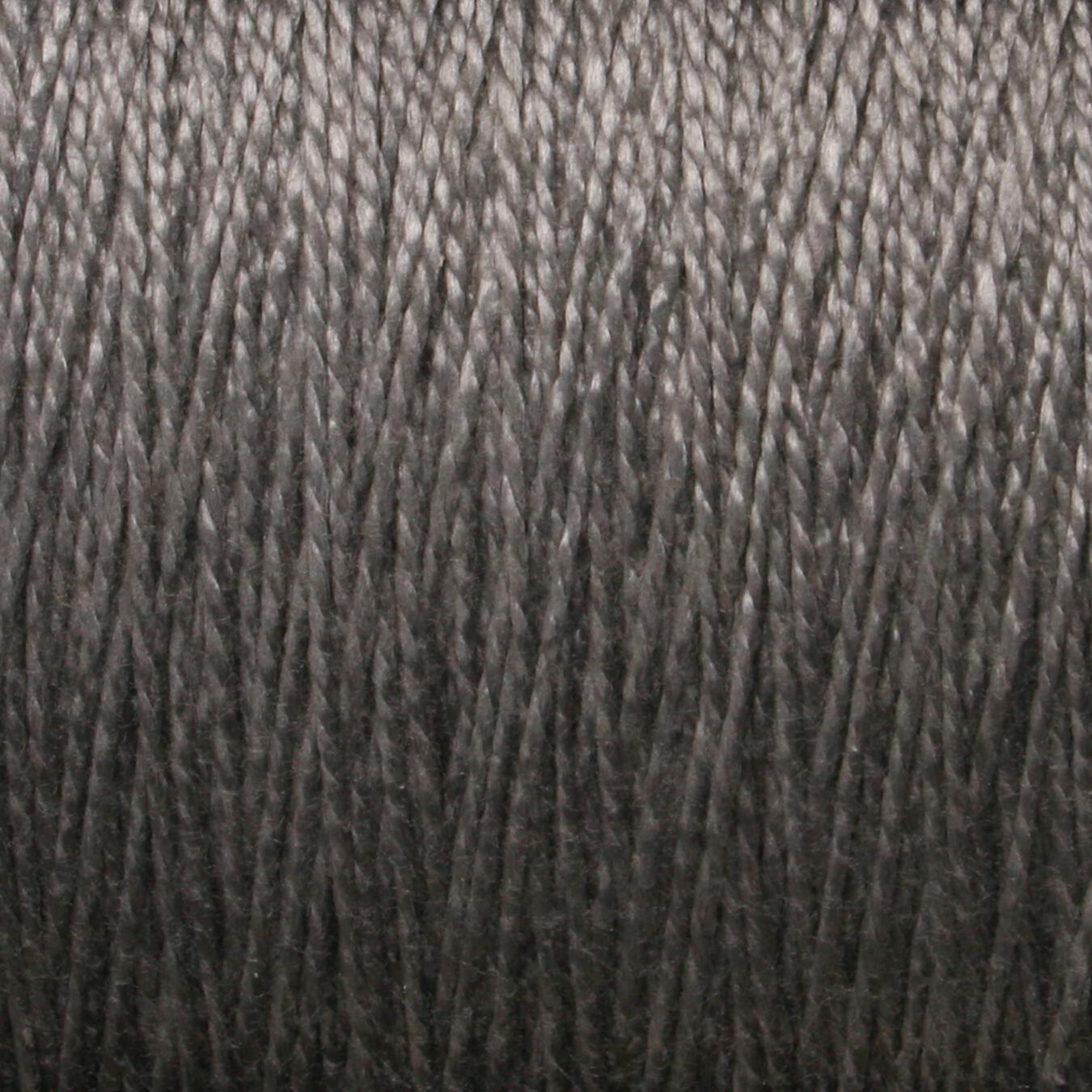 Close-up view of a large cone of 5/2 Pearl Cotton Yarn by Supreme Corp, showcasing tightly wound strands with a slight sheen, providing a detailed texture of the gray mercerized thread fibers.