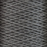 Close-up of a spool of gray 5/2 Pearl Cotton Yarn | Mini-cone by Supreme Corp, showcasing intricate crisscrossing threads wound tightly. The texture highlights the fibrous quality of the mercerized cotton yarn, ideal for weaving projects. The image emphasizes the pattern and texture of the material, perfect for detailed craftsmanship.