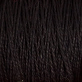 Close-up view of tightly wound, dark-colored Supreme Corp.'s 10/2 Pearl Cotton Yarn on a large cone. The strands are uniformly thick and tightly packed together, showcasing a consistent texture across the image with slight variations in shading due to lighting. This versatile yarn, often used in pearl cotton projects, offers durability and rich hues.