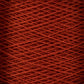 Close-up image of a large cone of red 10/2 Pearl Cotton Yarn by Supreme Corp., showcasing the fine texture and overlapping pattern of the tightly wound fibers. The image reveals a uniform and intricate crisscross design, highlighting the smooth and consistent appearance of this versatile yarn.