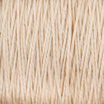 Close-up image of tightly wound, light beige-colored 10/2 Pearl Cotton Yarn from Supreme Corp. The texture is smooth with visible strands, conveying both softness and strength. This versatile yarn resembles natural fibers like cotton or linen and promises to be colorfast for lasting vibrancy, making it an excellent choice for various projects.