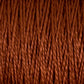 Close-up of Supreme Corp.'s 10/2 Pearl Cotton Yarn in large cone. The fibers are tightly twisted together, showcasing a detailed texture where individual strands interweave to create a thick, cohesive material. The earthy brown hue enhances the versatile yarn with a rich, warm appearance.