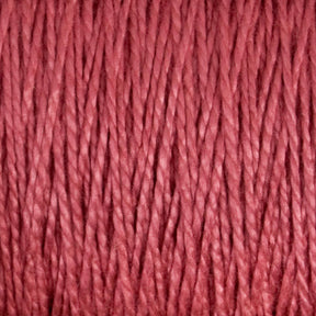 Close-up of a bundle of versatile 10/2 Pearl Cotton Yarn from Supreme Corp. with tightly wound fibers. The texture appears soft and smooth, indicating the yarn is made from high-quality Pearl Cotton, perfect for knitting or crocheting. The color is a rich, deep red with slight variations in shade, suggesting it is colorfast.