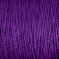 Close-up of strands of deep purple 10/2 Pearl Cotton Yarn by Supreme Corp., tightly wound together to form a textured surface. The versatile yarn fibers exhibit a consistent, smooth twist, creating an intricate pattern of lines and shadows. The color is rich and vibrant, emphasizing the yarn's soft, woolly texture on this large cone.