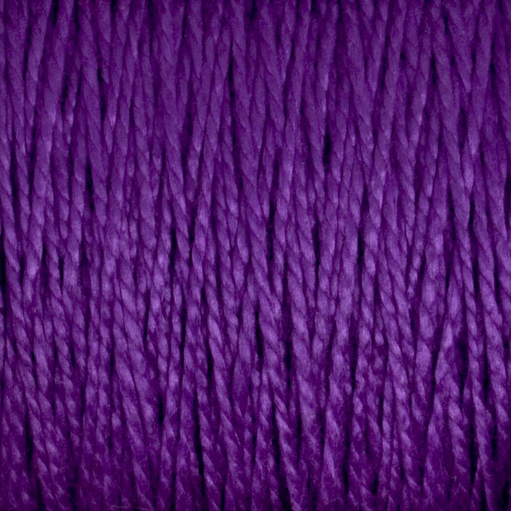 Close-up of strands of deep purple 10/2 Pearl Cotton Yarn by Supreme Corp., tightly wound together to form a textured surface. The versatile yarn fibers exhibit a consistent, smooth twist, creating an intricate pattern of lines and shadows. The color is rich and vibrant, emphasizing the yarn's soft, woolly texture on this large cone.