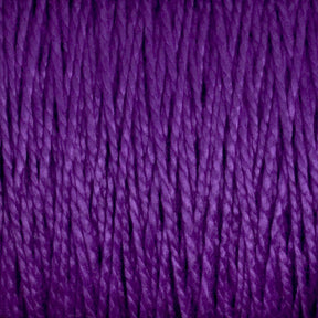 Close-up of strands of deep purple 10/2 Pearl Cotton Yarn by Supreme Corp., tightly wound together to form a textured surface. The versatile yarn fibers exhibit a consistent, smooth twist, creating an intricate pattern of lines and shadows. The color is rich and vibrant, emphasizing the yarn's soft, woolly texture on this large cone.