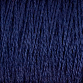 Close-up of dark blue 10/2 Pearl Cotton Yarn by Supreme Corp., with strands tightly wound together, creating a rich, textured pattern. This versatile yarn, available in a large cone, is uniformly colored with a slightly glossy finish, showcasing its colorfastness and highlighting the intricate weave of the individual fibers.