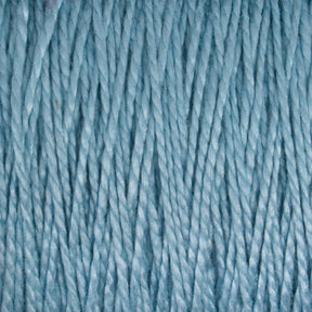 A close-up view of Supreme Corp.'s 10/2 Pearl Cotton Yarn in light blue, colorfast and wound tightly in parallel strands, creating a textured pattern. This versatile yarn on a Large Cone has a soft, slightly fuzzy appearance and uniform thickness throughout.