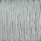 Close-up image of light gray 10/2 Pearl Cotton Yarn strands from Supreme Corp., tightly grouped together, showing their texture and twisted fibers. This versatile yarn appears soft, even in thickness, and colorfast.