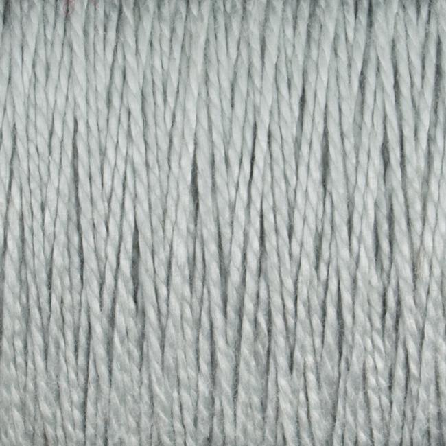 Close-up image of light gray 10/2 Pearl Cotton Yarn strands from Supreme Corp., tightly grouped together, showing their texture and twisted fibers. This versatile yarn appears soft, even in thickness, and colorfast.