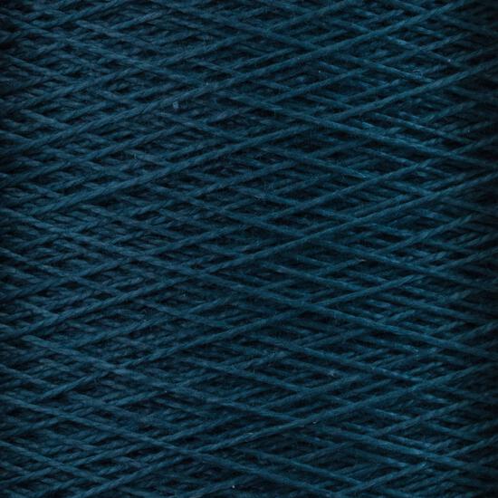 Close-up photo of Supreme Corp.'s 10/2 Pearl Cotton Yarn | Large Cone in a rich, dark blue color wound tightly around the spool in a crisscross pattern. The texture of this versatile yarn is slightly rough, with strands that are thin and uniform. The background is fully covered by the overlapping layers of this colorfast yarn.