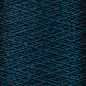 Close-up photo of Supreme Corp.'s 10/2 Pearl Cotton Yarn | Large Cone in a rich, dark blue color wound tightly around the spool in a crisscross pattern. The texture of this versatile yarn is slightly rough, with strands that are thin and uniform. The background is fully covered by the overlapping layers of this colorfast yarn.