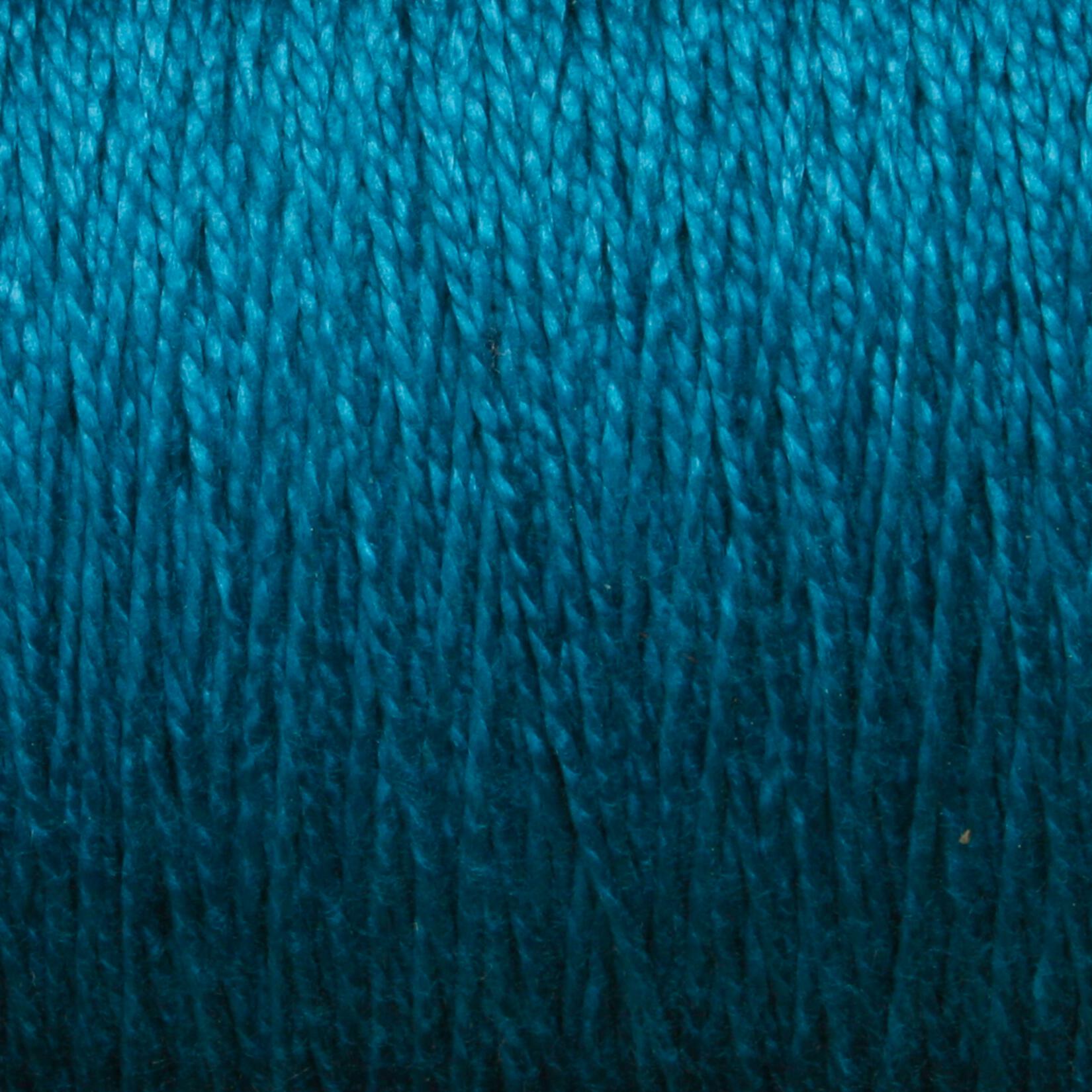 A close-up of the Supreme Corp. 10/2 Pearl Cotton Yarn in vibrant blue, showcasing the detailed texture of the intertwined threads. The colorfast quality is rich and consistent throughout, highlighting the fine fibers of this large cone yarn.