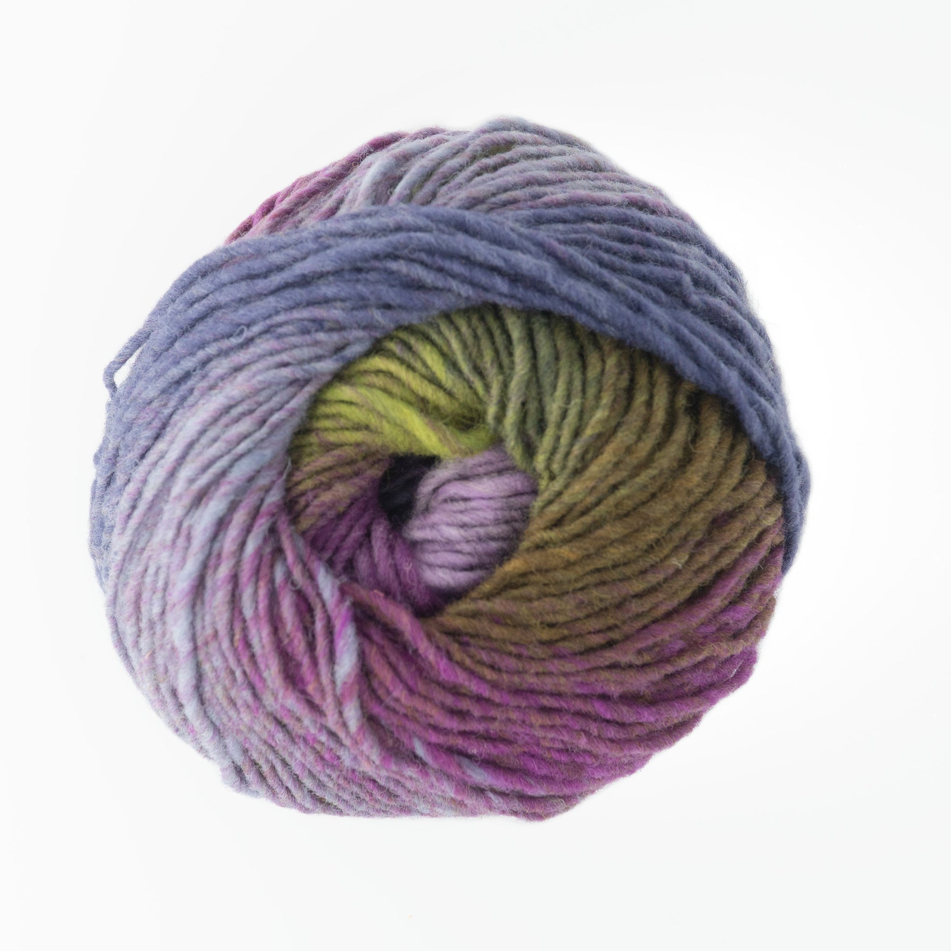 A close-up of a ball of Kureyon by Noro yarn from Knitting Fever / Euro Yarns, featuring a gradient color scheme that transitions from shades of purple and pink to green and bluish-gray. The yarn is neatly wound, displaying the various hues in a swirl pattern reminiscent of classic Noro colorways, set against a plain white background.