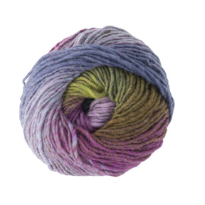 A ball of Kureyon by Noro yarn from Knitting Fever / Euro Yarns features a gradient color scheme that seamlessly transitions from blue to green to purple. Arranged in a spiral pattern, it highlights the vibrant hues characteristic of Noro colorways and its smooth texture.