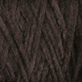 Close-up of Casco Bay Cotton Chenille yarn strands arranged in a crisscross pattern, creating a soft and textured appearance. The fibers appear thick and plush, suitable for knitting or crocheting cozy garments or accessories. Halcyon Yarn offers this luxurious large cone for your crafting needs.