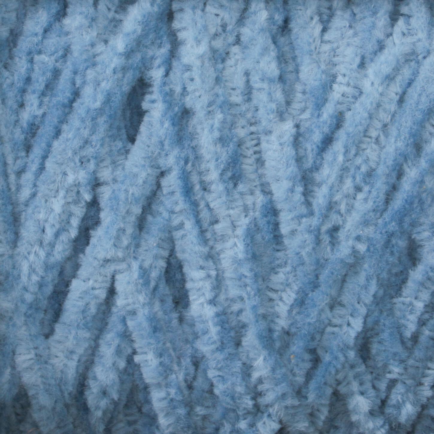 Close-up image of light blue, soft, fluffy fibers from Casco Bay Cotton Chenille | Large Cone by Halcyon Yarn, intertwined in a textured pattern reminiscent of intricate weaving.