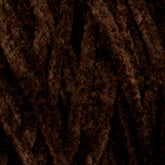 Close-up image of dark brown, fuzzy yarn fibers arranged in parallel strands. The texture appears soft and plush, suggesting the Casco Bay Cotton Chenille | Large Cone by Halcyon Yarn may be suitable for cozy knitted or crocheted projects.