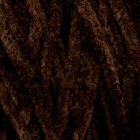 Close-up image of dark brown, fuzzy yarn fibers arranged in parallel strands. The texture appears soft and plush, suggesting the Casco Bay Cotton Chenille | Large Cone by Halcyon Yarn may be suitable for cozy knitted or crocheted projects.