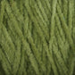 Close-up image of green, fuzzy strands of Halcyon Yarn's Casco Bay Cotton Chenille | Large Cone intertwined and wrapped tightly together. The texture appears soft and plush, with slight variations in the shades of green. The yarn is arranged in a way that highlights its detailed and fibrous texture.