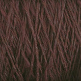 Close-up image of maroon-colored Block Island Blend Mini-cone from Halcyon Yarn, showing detailed textured strands tightly packed together. The yarn appears soft and thick, suitable for knitting or crocheting, and the threads display a mix of dark and lighter shades of maroon.