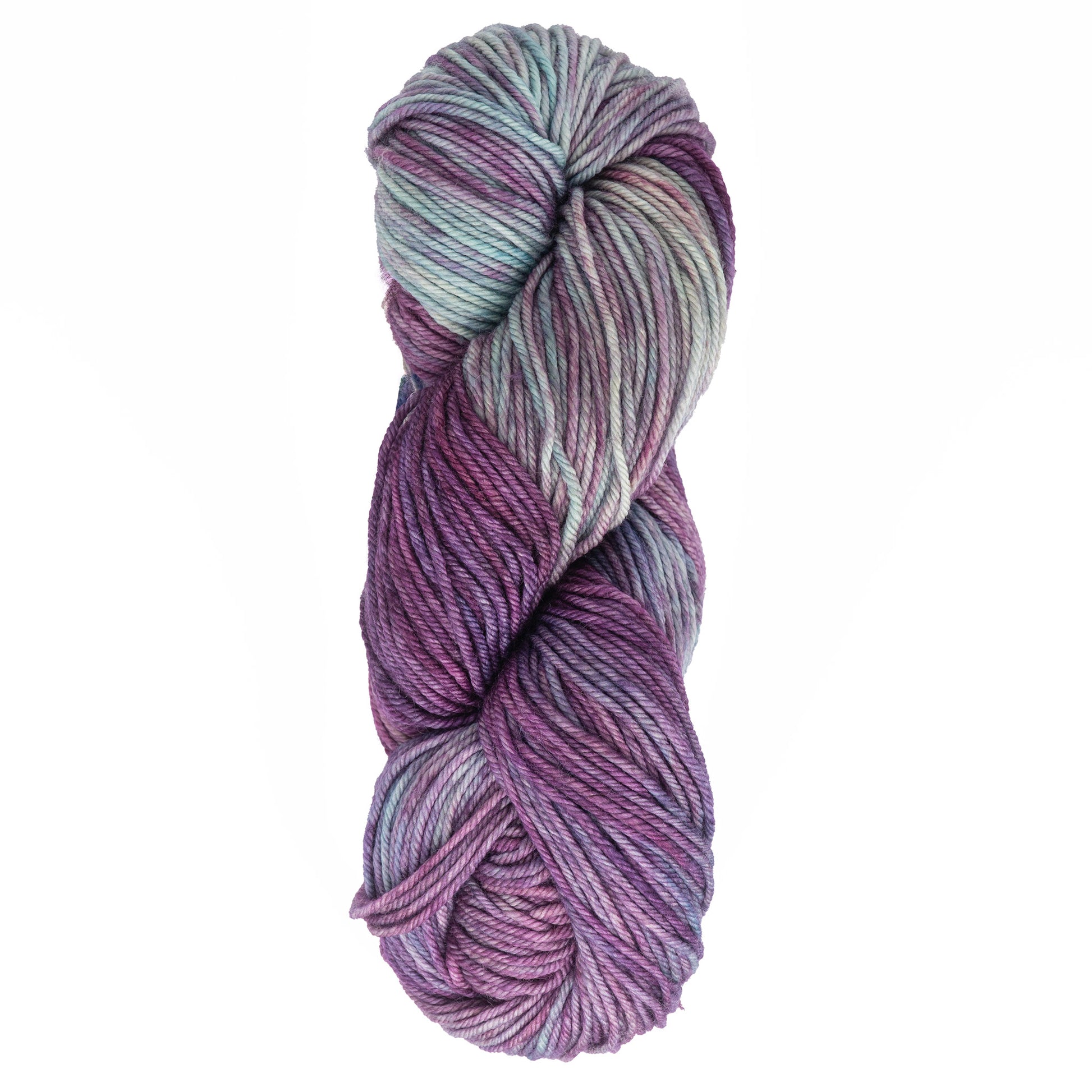 A skein of Malabrigo Yarn's Rios in shades of purple, blue, and teal is twisted into a compact coil. The superwash yarn colors blend seamlessly, creating a harmonious and visually appealing pattern.