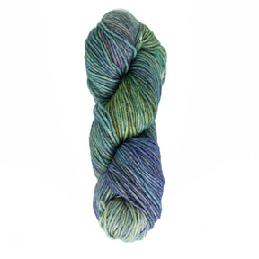 A skein of Malabrigo Rios yarn from Malabrigo Yarn, featuring shades of green, blue, and purple, coiled into a neat twist against a plain white background showcases its vibrant kettle-dyed colors.