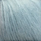 Close-up image of a skein of Plymouth Baby Alpaca Brush by Plymouth Yarn Co. This soft, fuzzy light blue yarn features slightly fluffy fibers wound tightly in a spiral pattern. It's perfect for creating cozy blankets or luxurious alpaca accessories.