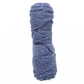 A tightly wound skein of Lamb's Pride Bulky Yarn by Brown Sheep on a white background, perfect for dedicated knitters crafting intricate Icelandic sweaters.