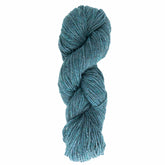 A turquoise skein of Briggs & Little's Tuffy Canadian Sock Yarn is twisted into a neat bundle. The worsted weight yarn appears thick and is evenly wound, showcasing a blend of light and dark turquoise fibers, creating a textured look perfect for cozy winter socks.