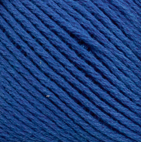 Close-up image of tightly wound, textured strands of Cotton Fleece in dark blue, by Brown Sheep. The yarn appears to be made from natural cotton fiber, with visible individual threads intertwined to create a uniform and cohesive surface ideal for intricate knitting patterns.