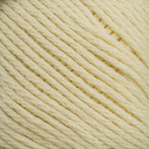 Close-up image of off-white or cream-colored Brown Sheep Cotton Fleece yarn. The strands are tightly wound together, showcasing the detailed texture and slight fuzziness of the fibers. The yarn appears soft and suitable for knitting patterns or crocheting various items in soft pastels.