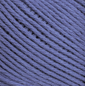 Close-up image of Brown Sheep Cotton Fleece in purple, showing the texture and individual fibers. The strands are arranged neatly in a parallel pattern, highlighting the smooth and slightly fuzzy surface of the yarn. This soft pastel-toned yarn is perfect for delicate knitting patterns.