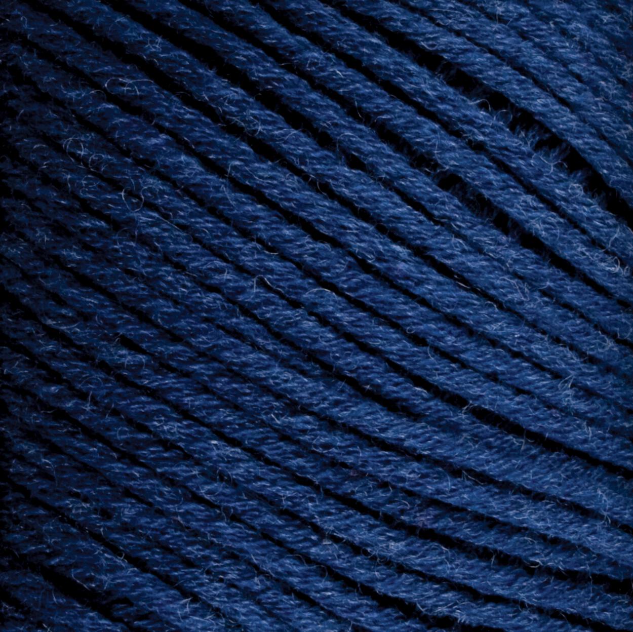 Close-up of Brown Sheep Cotton Fine, dark blue cotton yarn tightly wound into a ball. The texture of the yarn fibers is visible, showcasing a soft, slightly fuzzy surface perfect for machine knitters. The strands are neatly organized and evenly spaced.