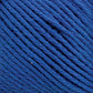 Close-up view of Brown Sheep's Cotton Fine blue cotton yarn strands tightly wound together. The texture and individual fibers of the yarn are clearly visible, showcasing the vibrant blue color and slightly varied hues within the strands—a perfect choice for machine knitters.