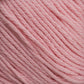 Close-up of Brown Sheep's Cotton Fine, featuring soft pastel pink cotton yarn with tightly woven strands that are neatly arranged to showcase its texture and color detail. The smooth and even fibers make it perfect for crafting crochet, knitting, or other textile projects, suitable for both hand crafters and machine knitters.