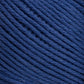 Close-up image of Brown Sheep's Cotton Fine yarn in dark blue. The yarn is neatly wound in a ball, with the individual strands tightly packed and running parallel to each other, showcasing its texture and thickness perfect for weaving or machine knitting.