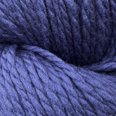 A close-up image of thick, dark purple Cascade Eco Plus Wool Yarn by Cascade Yarns. The texture is visibly soft and woolly, with multiple strands twisted together. The fibers appear fuzzy, indicating a cozy material suitable for felted knitting or crocheting.