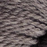 Close-up shot of twisted grey Cascade Eco and Cascade Eco Plus Wool Yarn by Cascade Yarns, showing the texture and individual fibers. The strands are tightly wound together, creating a thick and sturdy appearance suitable for knitting or crocheting. The image highlights the natural and soft quality of this Eco yarn.