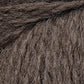 Close-up image of the textured Cascade Eco and Cascade Eco Plus Wool Yarn, showing individual fibers and strands intertwined. The Peruvian Highland wool from Cascade Yarns appears soft and thick, making it suitable for knitting or crocheting warm garments.