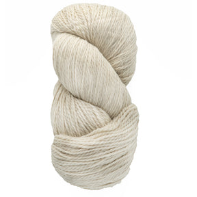 A skein of Cascade Eco and Cascade Eco Plus Wool Yarn from Cascade Yarns twists into a coil, highlighting its thick and soft texture. Crafted from Peruvian Highland wool, this eco-friendly yarn in its natural off-white beige color is ideal for knitting or crocheting projects that demand both durability and charm.