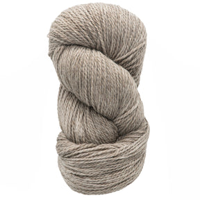 The Cascade Eco and Eco Plus Wool Yarn from Cascade Yarns is coiled neatly, showcasing its thick, textured strands in a beige hue that embodies eco-friendliness. Crafted from Peruvian Highland wool, this yarn appears soft and ideal for knitting or crocheting projects. Its natural beauty takes center stage against the plain white background.